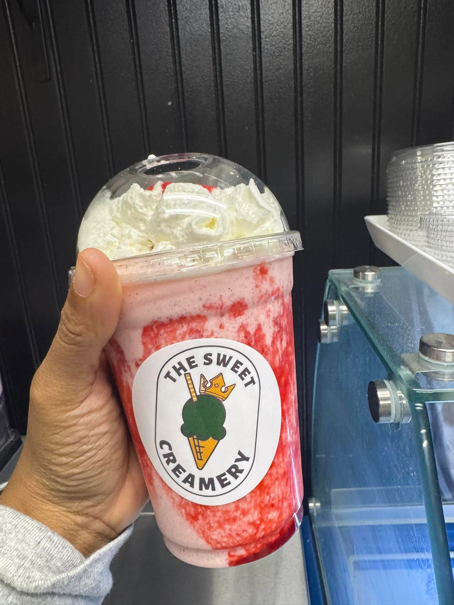 Booza ice cream shake with whipped cream and house sticker